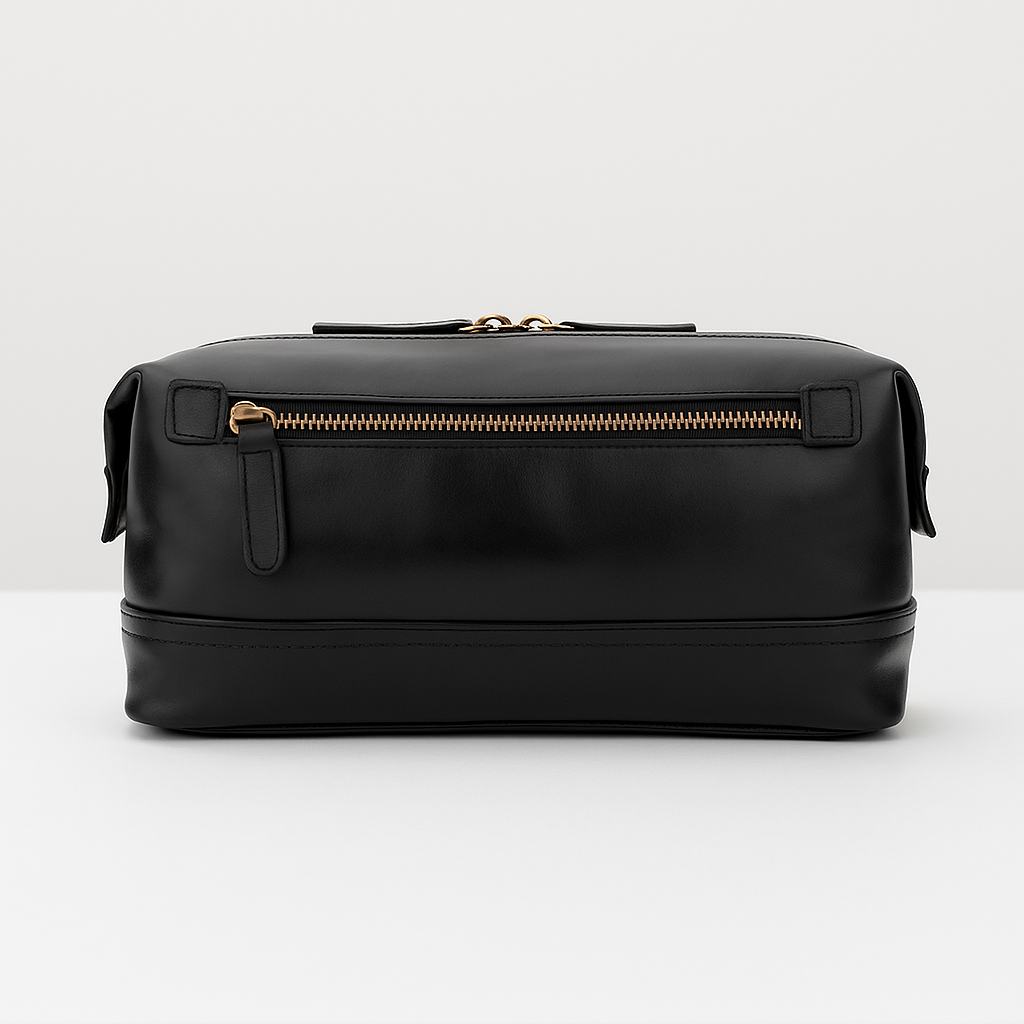 Sleek black leather dopp kit with gold zipper front view.