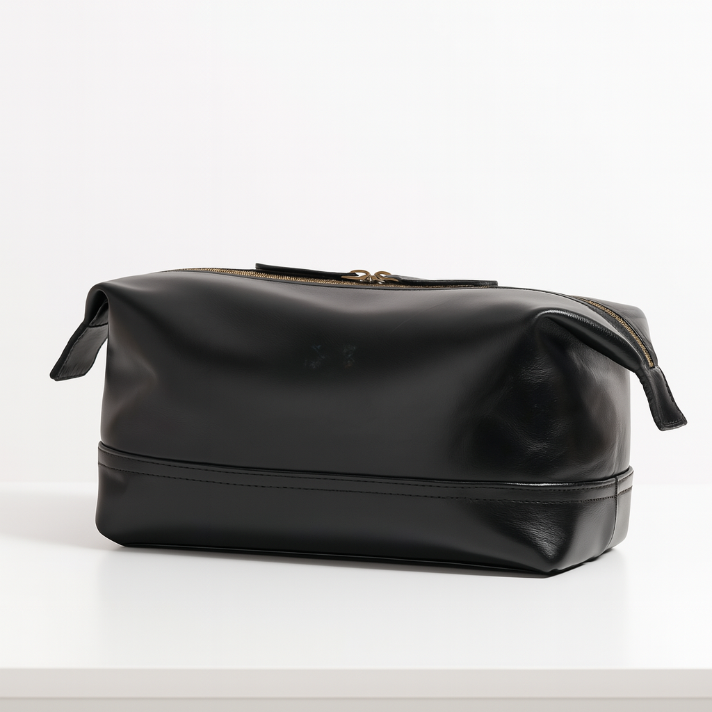 back view of black leather dopp kit with gold zipper