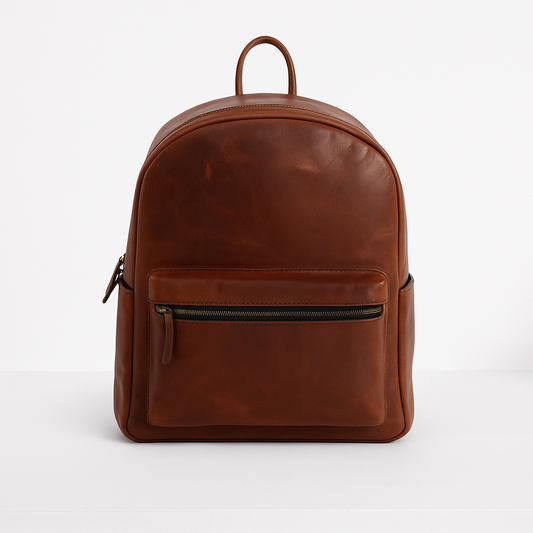Front view of brown leather backpack with zippered front pocket