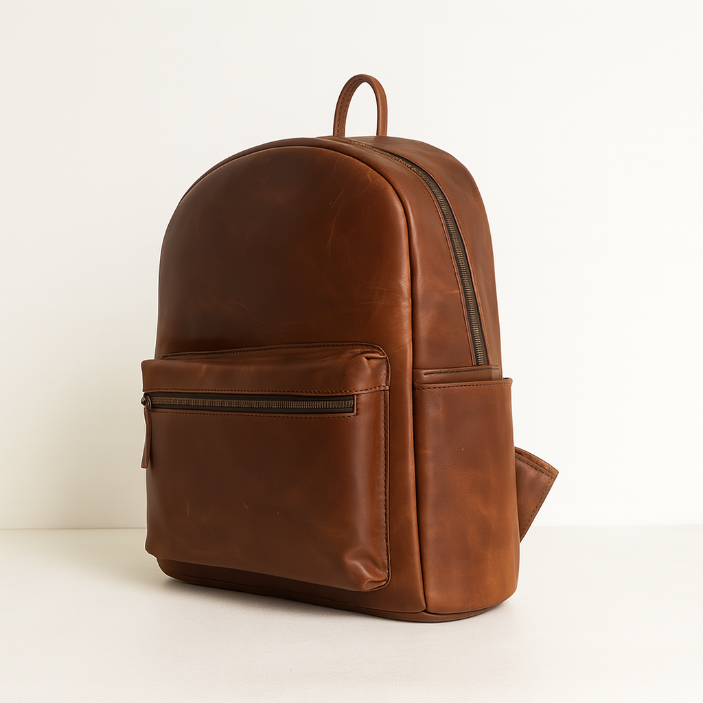 Side view of brown Heritage Leather Backpack with front zip pocket