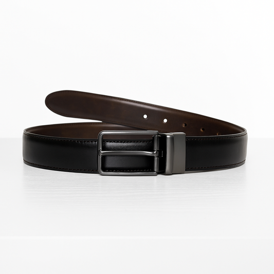Reversible black and brown men’s leather belt on white table