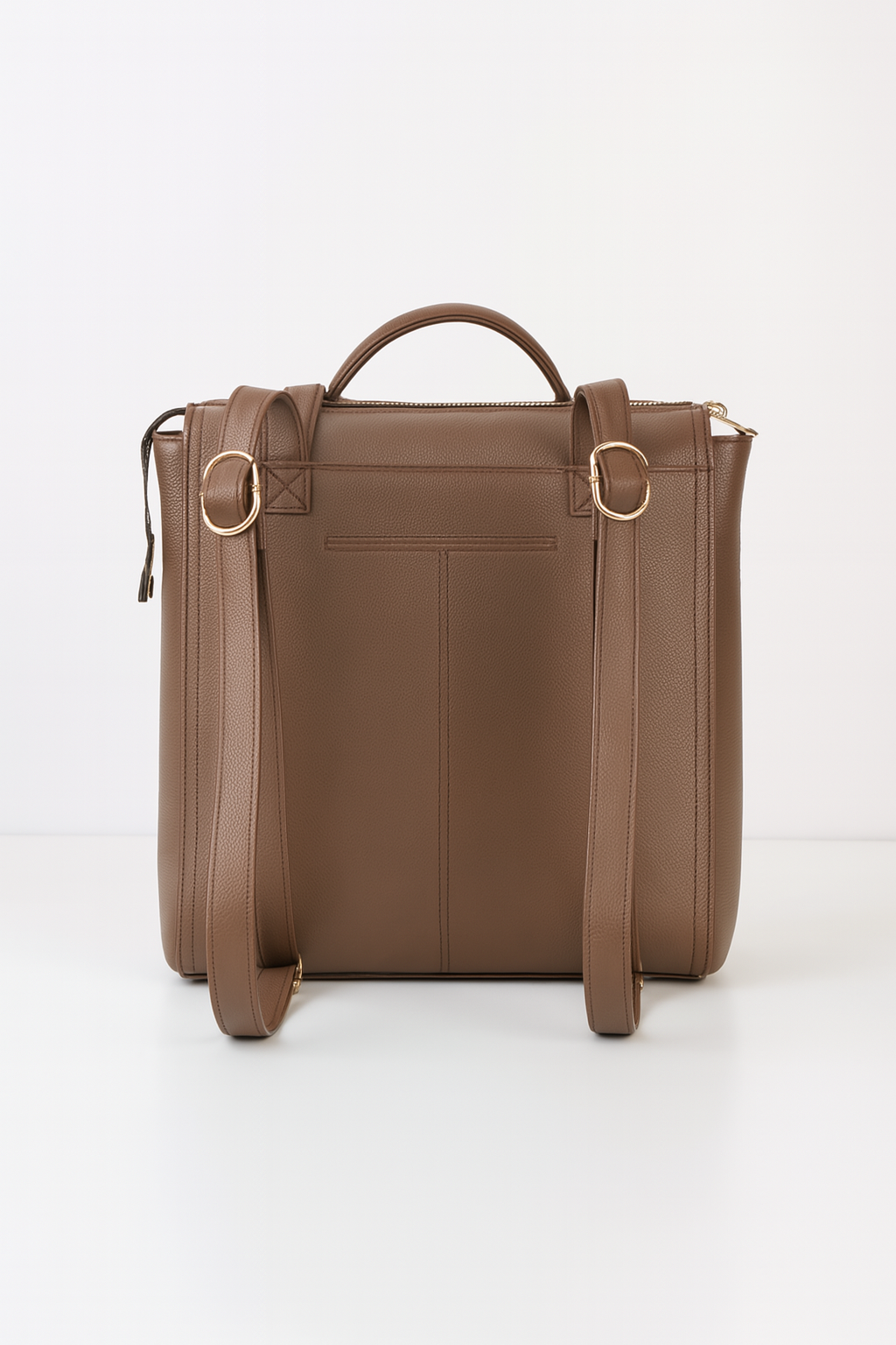 Convertible brown leather backpack with adjustable straps and top handle.